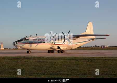 Kosmos Airlines Antonov An-12 four-engine turboprop cargo airplane parked on the ground Stock Photo