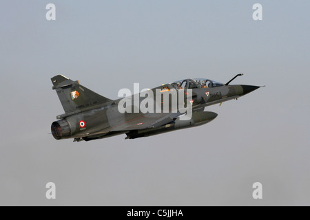 Military aviation. French Air Force Dassault Mirage 2000N military jet plane on takeoff and flying in a blue sky Stock Photo