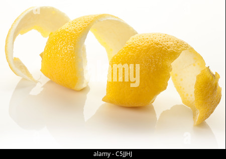 Twist of citrus peel on a white background. Stock Photo