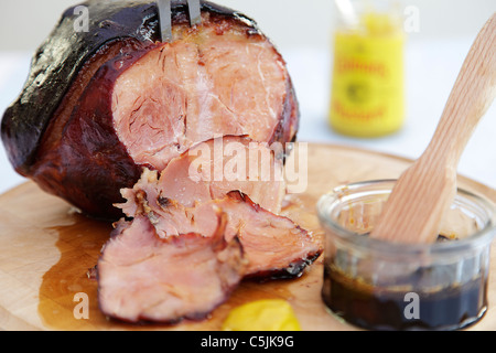 Glazed Roast Pork joint with mustard Stock Photo