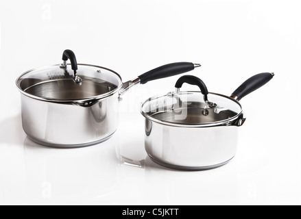 Two stainless steel saucepans, on a white background. Stock Photo