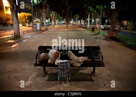 Homeless person sleeping in the street Tel Aviv Israel Stock Photo