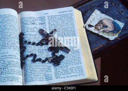 The Bible open at the book of Ezequiel, cross and rosary, Los Loceros, New Mexico, USA Stock Photo