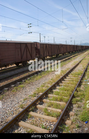 Freight train and rails as seen from inside the railroad station, Fevzipasa, near Gaziantep / Antep, Turkey Stock Photo