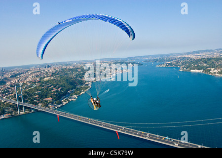 Powered paraglider flying over the Bosphorus Bridge, aerial, Istanbul - 2010 European Capital of Culture â€“ Turkey Stock Photo