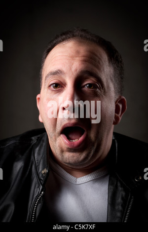 A shocked or surprised man with a goofy look on his face. Stock Photo