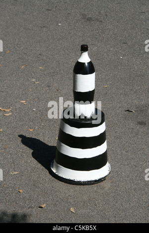 one single home made black and white stripes traffic cone in street road Stock Photo