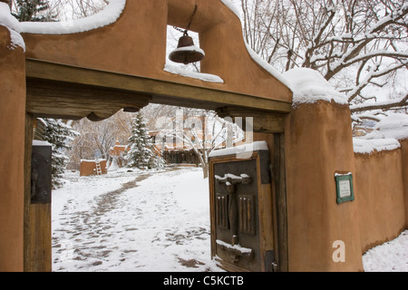 Gate to Mabel Dodge Lujan house in snow Stock Photo