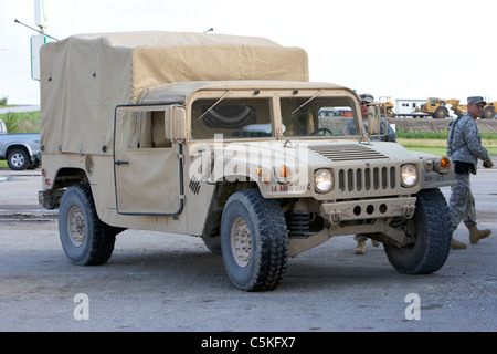 Iowa army national guard humvee cargo troop carrier and soldiers united states military in front of levees at the missouri river Stock Photo