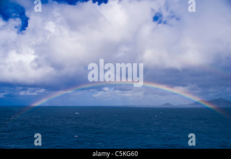 A nice rainbow seen coming into port of call at Saint Maarten Island. French and Dutch share this island. Stock Photo