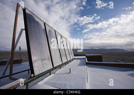Solar panels installed on top of residence for thermal heating. Stock Photo