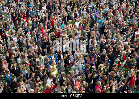 Thousands of Norwegian's gather outside Oslo City Hall, to attend a rose flower vigil for victims of attacks.Photo:Jeff Gilbert Stock Photo