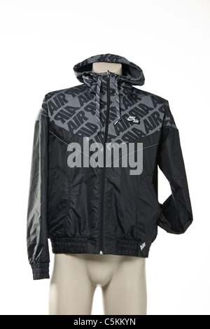 Nike Air men's windrunner sportswear rain jacket. Reversible black with detail one side, grey the other. Nylon full zip jacket. Stock Photo