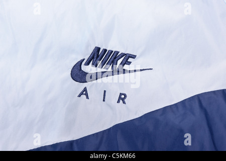 Nike Air windrunner men's sportswear nylon windcheater jacket. In light blue/dark blue, with hood. Logo detail Stock Photo