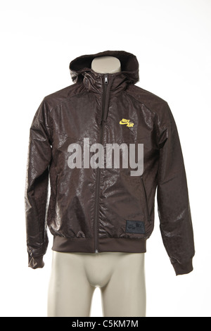 Mens Nike Air Windrunner sportswear nylon windcheater jacket in brown with yellow logo and all over print detail. Stock Photo