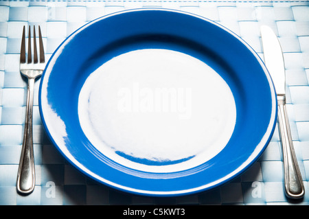 empty plate with fork and knife Stock Photo