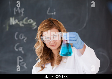 Female scientist conducting an experiment Stock Photo