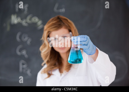 Female scientist carrying out an experiment