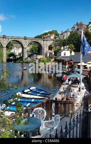 The River Nidd at Knaresborough, North Yorkshire, straddled by a Stone Railway Viaduct. Viewed from the castle, with rowing boats in the foreground. Stock Photo