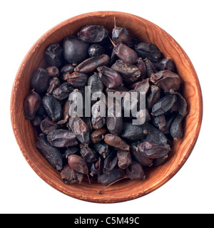 Wooden bowl full of dry barberry isolated on white background Stock Photo