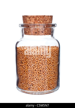 glass bottle full of mustard seeds isolated on white background Stock Photo