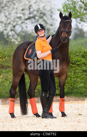 woman and Hanoverian horse Stock Photo