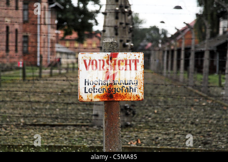 auschwitz warning signal for electric fence Stock Photo