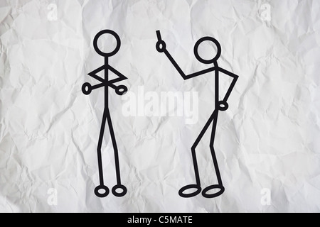 Simple drawing of two humanoid figures having an argue over a paper texture Stock Photo