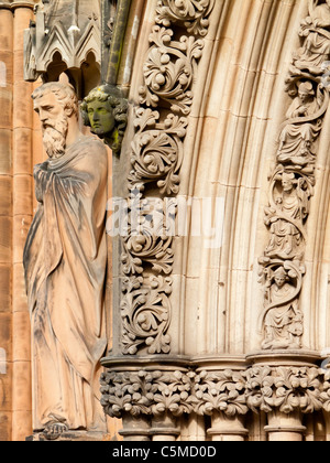 Detail of the west front of Lichfield Cathedral with carved stone figures of saints, kings and queens restored by Gilbert Scott Stock Photo