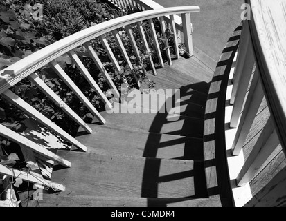 Black and white image of a Victorian style house circular staircase Stock Photo