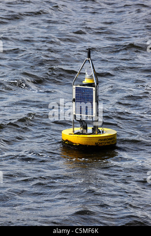 Solar powered YSI EMM700 Bay Buoy / environmental module platform for monitoring the water quality  in Cardiff Bay, South Glamorgan, Wales, UK Stock Photo