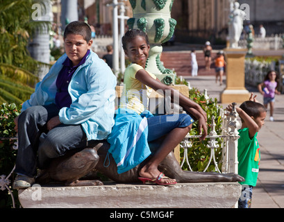Cuba, Trinidad. Boy and Girl in the Plaza Mayor. Stock Photo