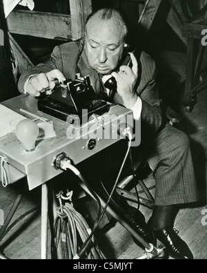 ALFRED HITCHCOCK (1899-1980) on the set of his 1954 film 'Dial M For Murder' Stock Photo