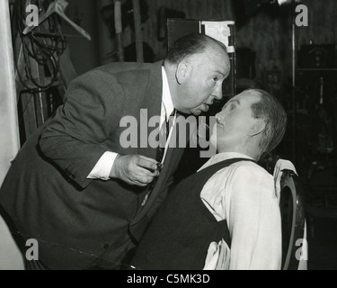ALFRED HITCHCOCK with dummy on set of his film 'Dial M For Murder' in 1954 Stock Photo