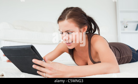 Woman having fun with her tablet Stock Photo