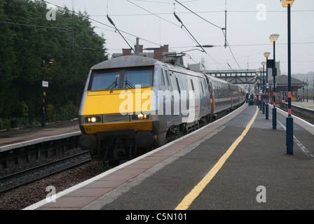 British Rail Class 91 National Express train 91111 electric locomotive Terence Cuneo at Grantham station on cloudy grey day Stock Photo