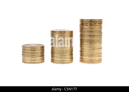 It shows the piles of coins on white background Stock Photo - Alamy