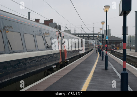 British Rail Class 91 National Express train 91111 electric locomotive Terence Cuneo at Grantham station on cloudy grey day Stock Photo