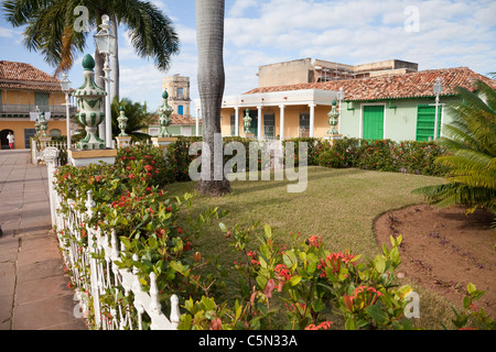 Cuba, Trinidad. Plaza Mayor. Tower of the Palacio Cantero in rear center, now the Museo Historico Municipal. Stock Photo