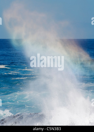 Rainbow effect through braking wave Stock Photo
