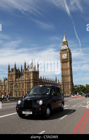 A London taxi on Westminster Bridge, Westminster, London, England, U.K. Stock Photo