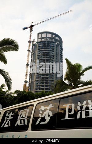 New Chinese concrete tower block / blocks under construction, and building site, in Leshan city. Sichuan Province, China Stock Photo