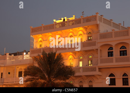 Old building in Muscat illuminated at night Stock Photo