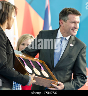 Lord Sebastian Coe holds up new Olympic medals ' 1 year to go to'  London 2012 Olympics Trafalgar Square Stock Photo