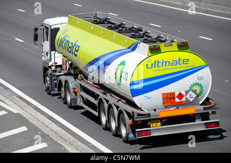 Above side & back view of BP supply chain tanker lorry truck with Hazchem sign on rear of articulated Ultimate petrol trailer transport on UK motorway Stock Photo