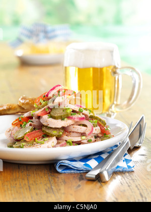 Bavarian sausage salad with pretzel Stock Photo