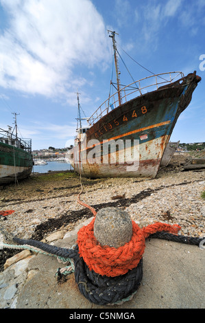 Wrecks of small trawler fishing boats in the harbour of Camaret-sur-Mer, Finistère, Brittany, France Stock Photo