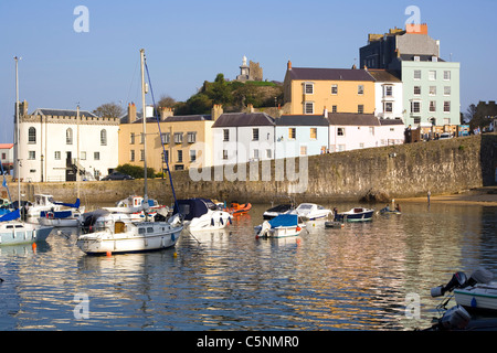 Pastel coloured buildings around the harbour in autumn sunshine, Tenby, Pembrokeshire, Wales, UK Stock Photo