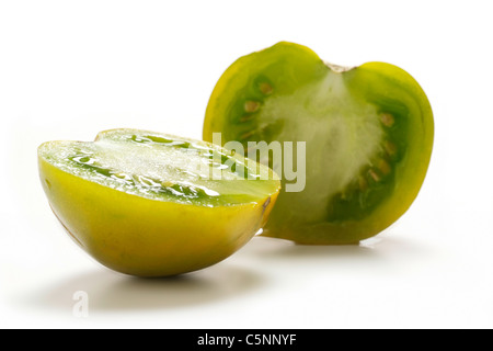 Tomato varieties:  Lime Green, two halves Stock Photo