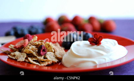 Yoghurt with cornflakes and fruits Stock Photo
